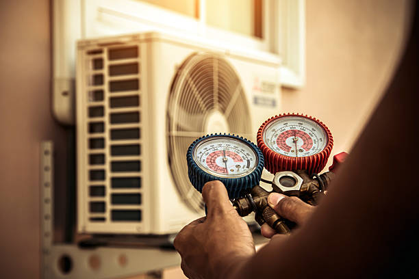 Professional Ductwork Repair technician working in Raynham Center, MA